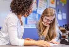 Teacher and student working together
