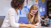 Teacher and student working together