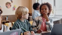 Two elementary students working together