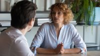 Two people talking in an office