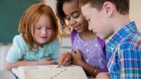 Elementary students playing a dictionary game