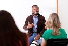 Guest speaker in high school classroom