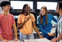 A small group of high school students collaborating on a leadership project