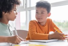 Two elementary students working together
