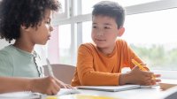 Two elementary students working together