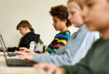 Elementary students working on laptops