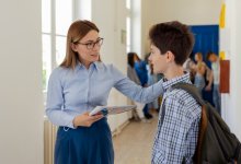 A principal prioritizing school culture talking to a student