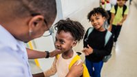 Educator greeting students