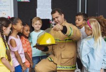 Firefighter meets with elementary students