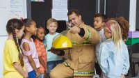 Firefighter meets with elementary students