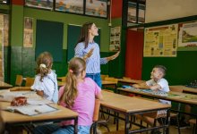 Teacher talking to students in class