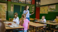 Teacher talking to students in class