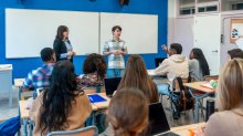 Student leading an opening activity in class