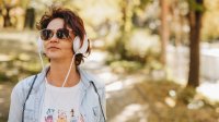 Person on a walk while wearing headphones