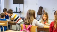 Elementary students working at math centers
