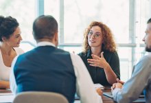 Small group of coworkers talking