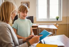 Elementary teacher and student talking