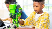 Students working with robots