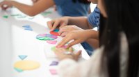 Elementary students using math manipulatives