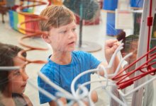 Two children looking at a museum exhibit