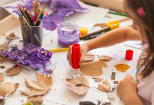 Elementary student working with found objects, representing playful learning in the early grades