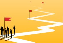 An illustration of a group of teachers on a winding path with checkpoints marked with flags.