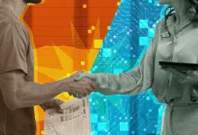 technology professional and teacher shake hands over tech success