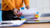 Person sorting papers