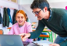 Teacher working with student