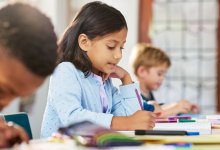 Elementary students writing in class