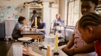 Middle school students doing an experiment in science class