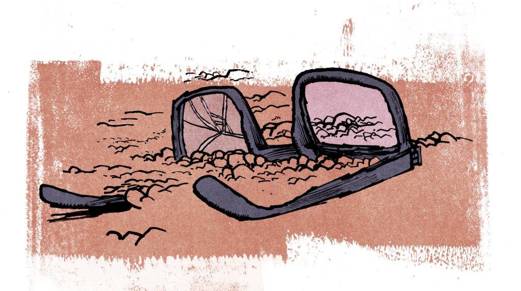 broken glasses upside down in the dirt