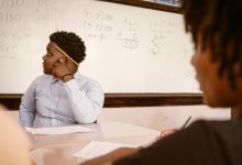 A photo of middle school students sitting at their desk engaged during math class.
