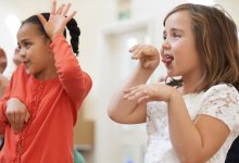 Elementary students acting out a story in class