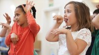 Elementary students acting out a story in class