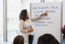 A photo of two school leaders mentoring new teachers.