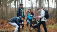 High school students and teacher during an outdoor citizen science project