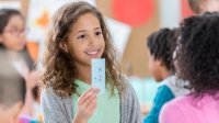 Elementary students using math flash cards