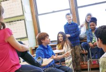 Middle school students having a class discussion