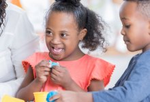 Preschool students playing with clay