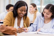 Two students working together on a writing assignment