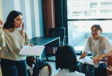High school student speaking to group of other students