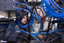 Teen working with an IT instructor