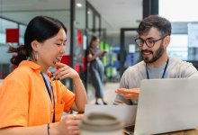 A photo of two teachers meeting to plan a lesson.