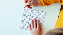 Elementary student working on a sodoku puzzle