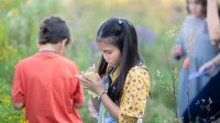 Elementary students participating in outdoor learning lesson