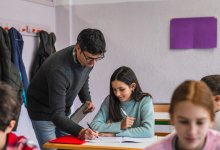 A photo of a teacher giving a student feedback.