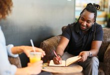 A teacher who's preparing for school leadership takes notes.