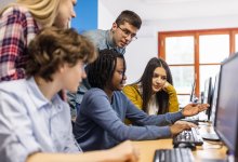 A photo of high school students working together.