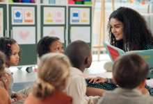 Teacher reading picture book to students
